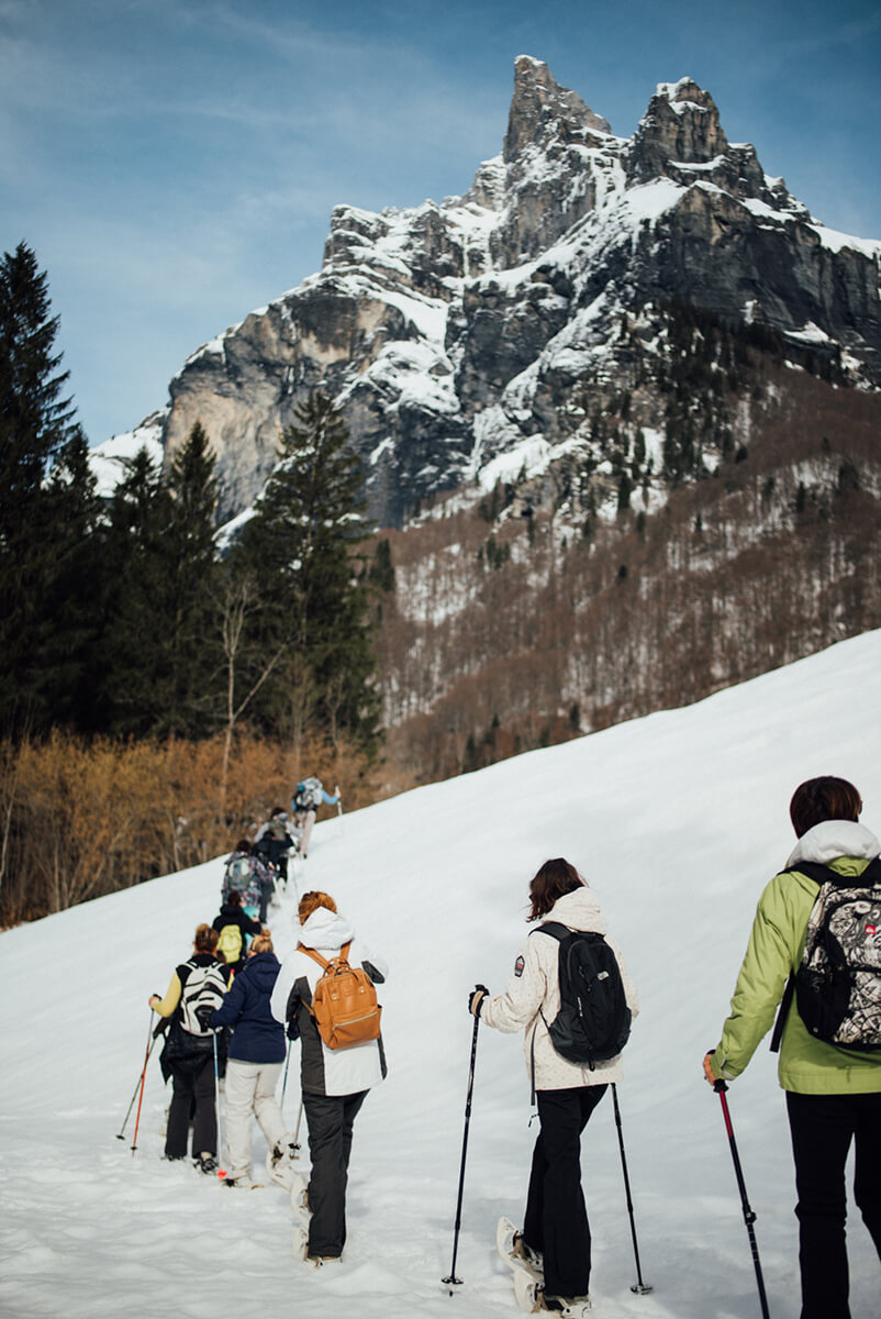 photoshoot for a family snowshoeing in the snow in Morzine Avoriaz (French Alps) on their ski holiday