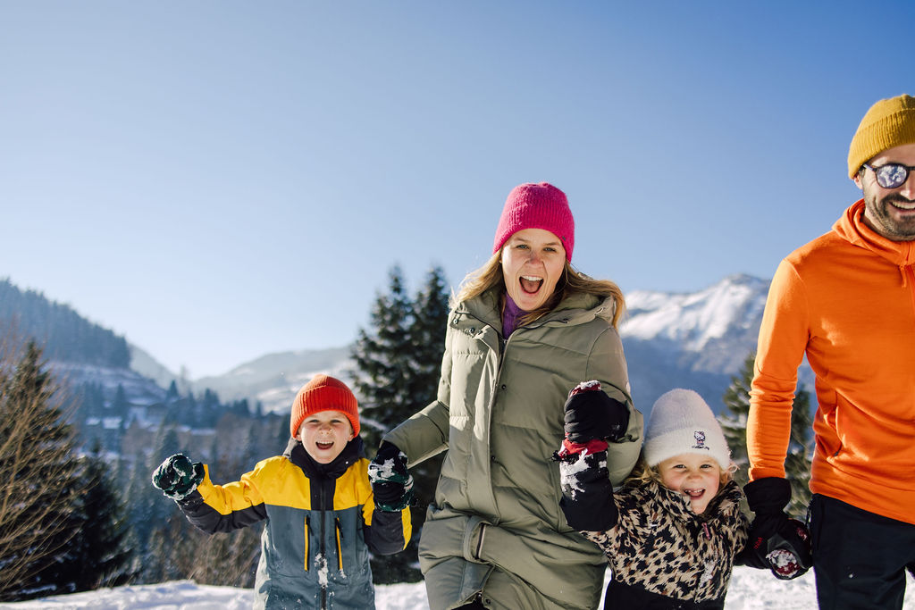 Happy family moments in snow in Morzine