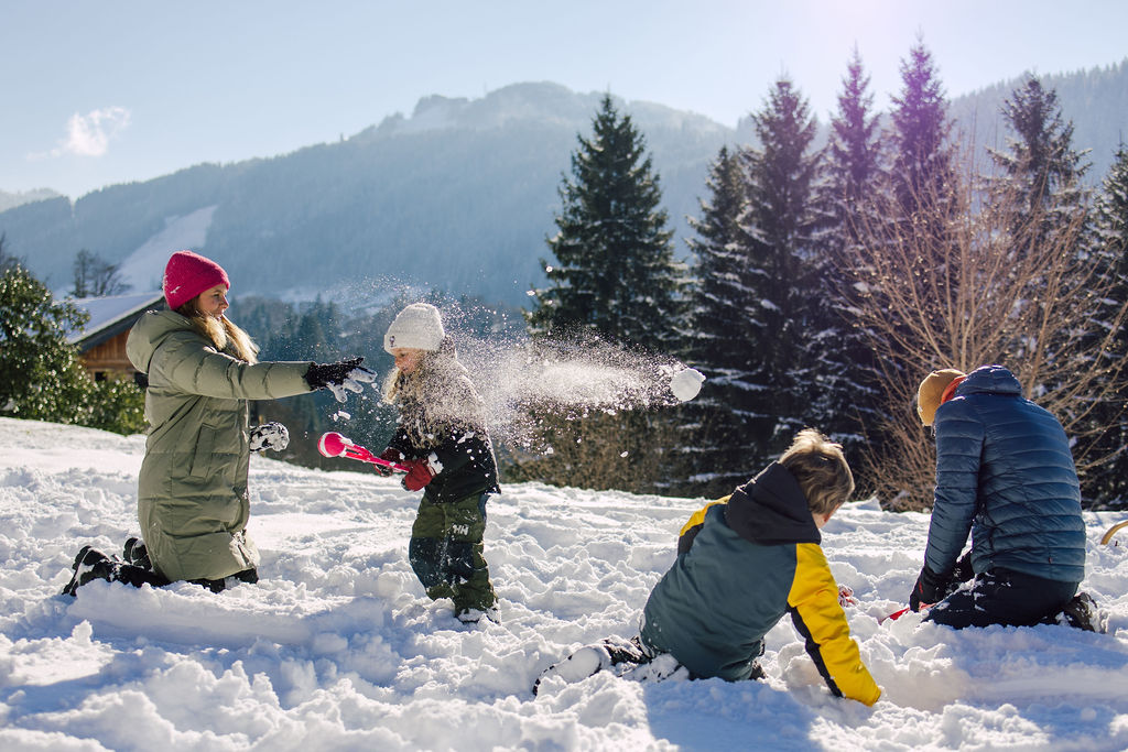 Family playing in snow in Morzine